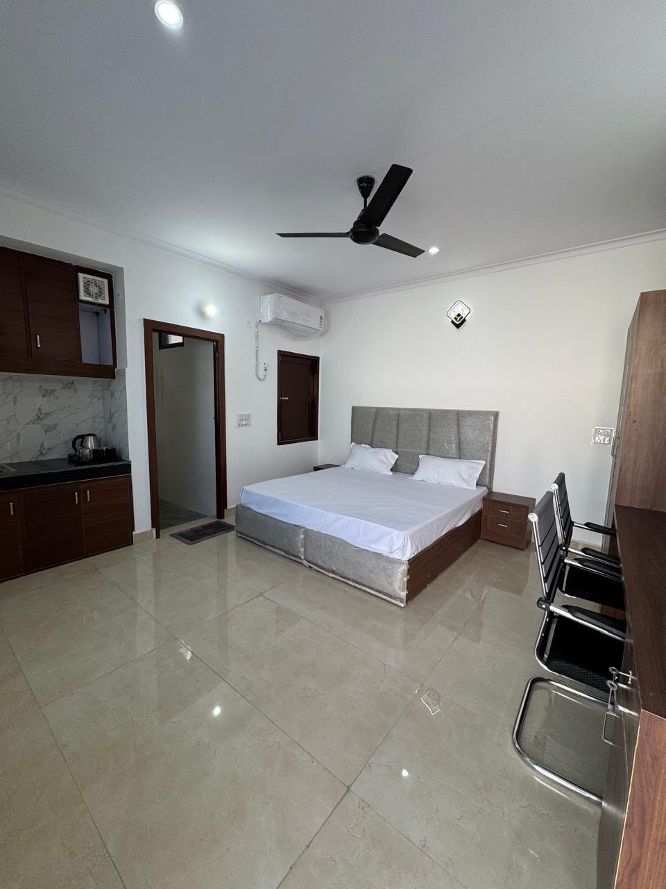 Fully furnished AC bedroom with double bed at The Sukoon Stays PG, Sector 128 Noida