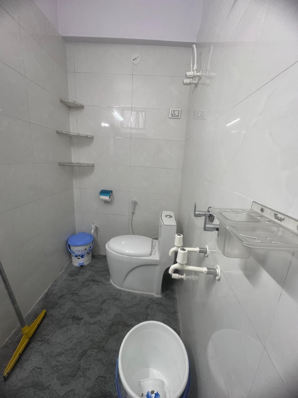 Clean and hygienic washroom with premium fixtures at The Sukoon Stays Noida